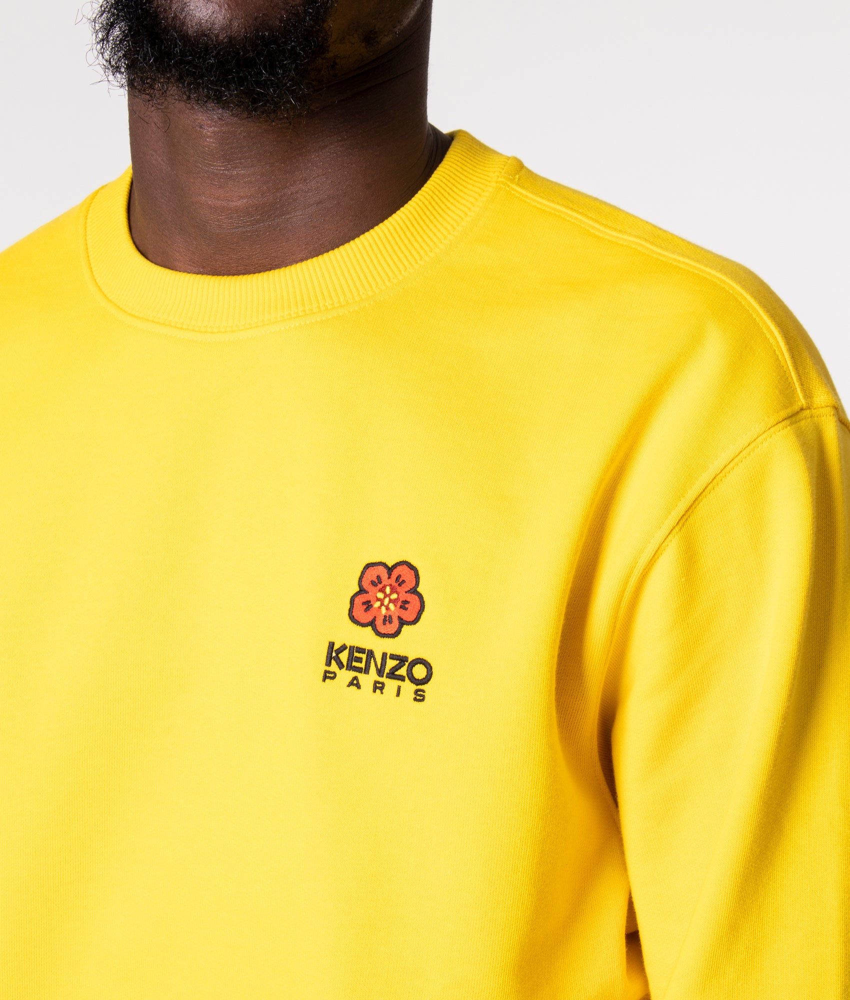 Crest Logo Sweatshirt in Yellow by KENZO at EQVVS. Detail Shot. 