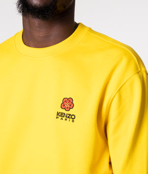 Crest Logo Sweatshirt in Yellow by KENZO at EQVVS. Detail Shot. 