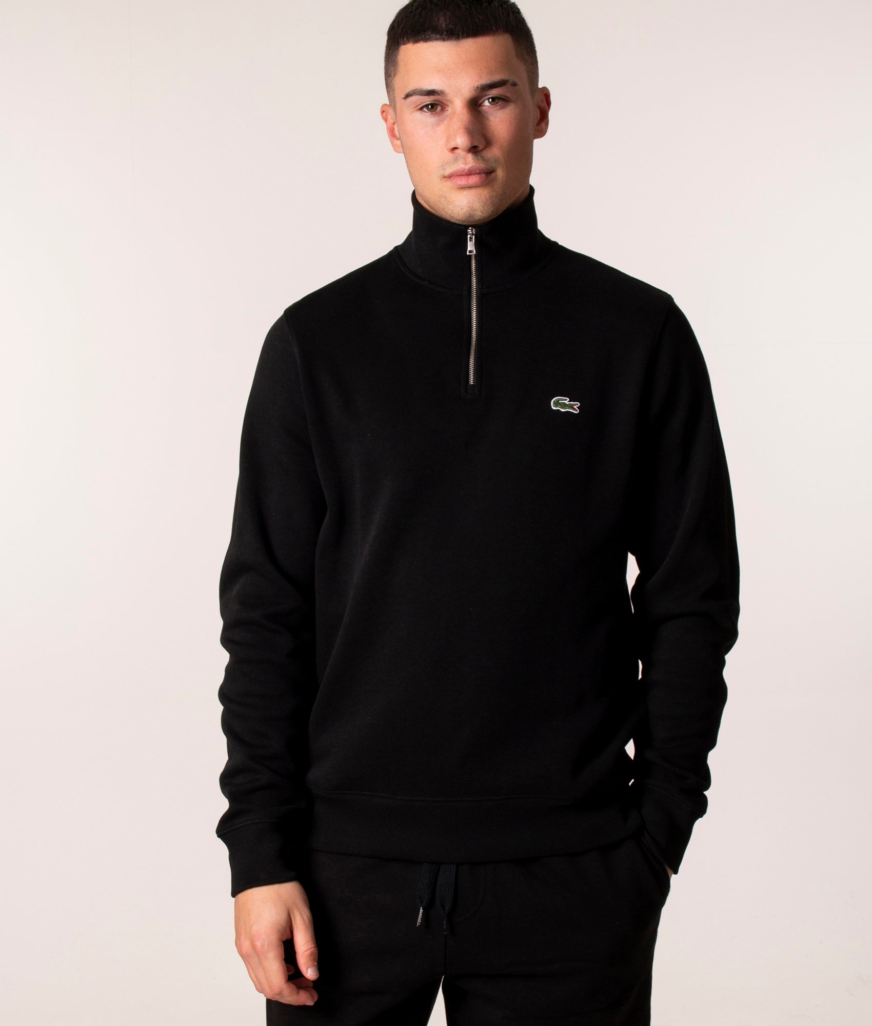 Lacoste Quarter Zip Croc Logo Sweatshirt at EQVVS Menswear. Model front Shot.