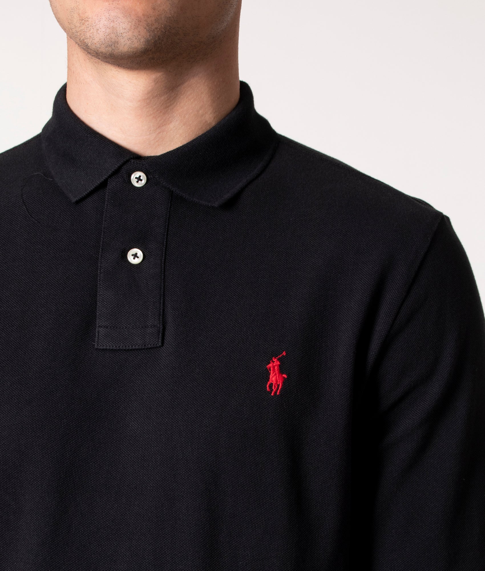 Polo Ralph Lauren Custom Slim Fit Long Sleeve Polo Shirt in Black at EQVVS Menswear. Model detail shot.