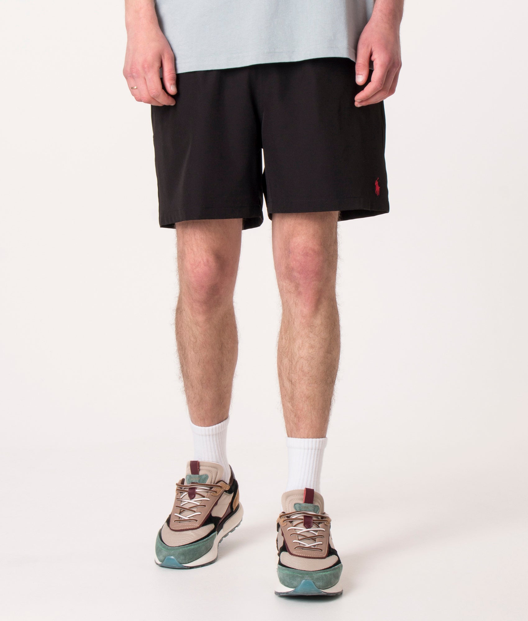 Polo Ralph Lauren Regular Fit Traveler Mid Swim Shorts in Polo Black at EQVVS Menswear. Model front shot.