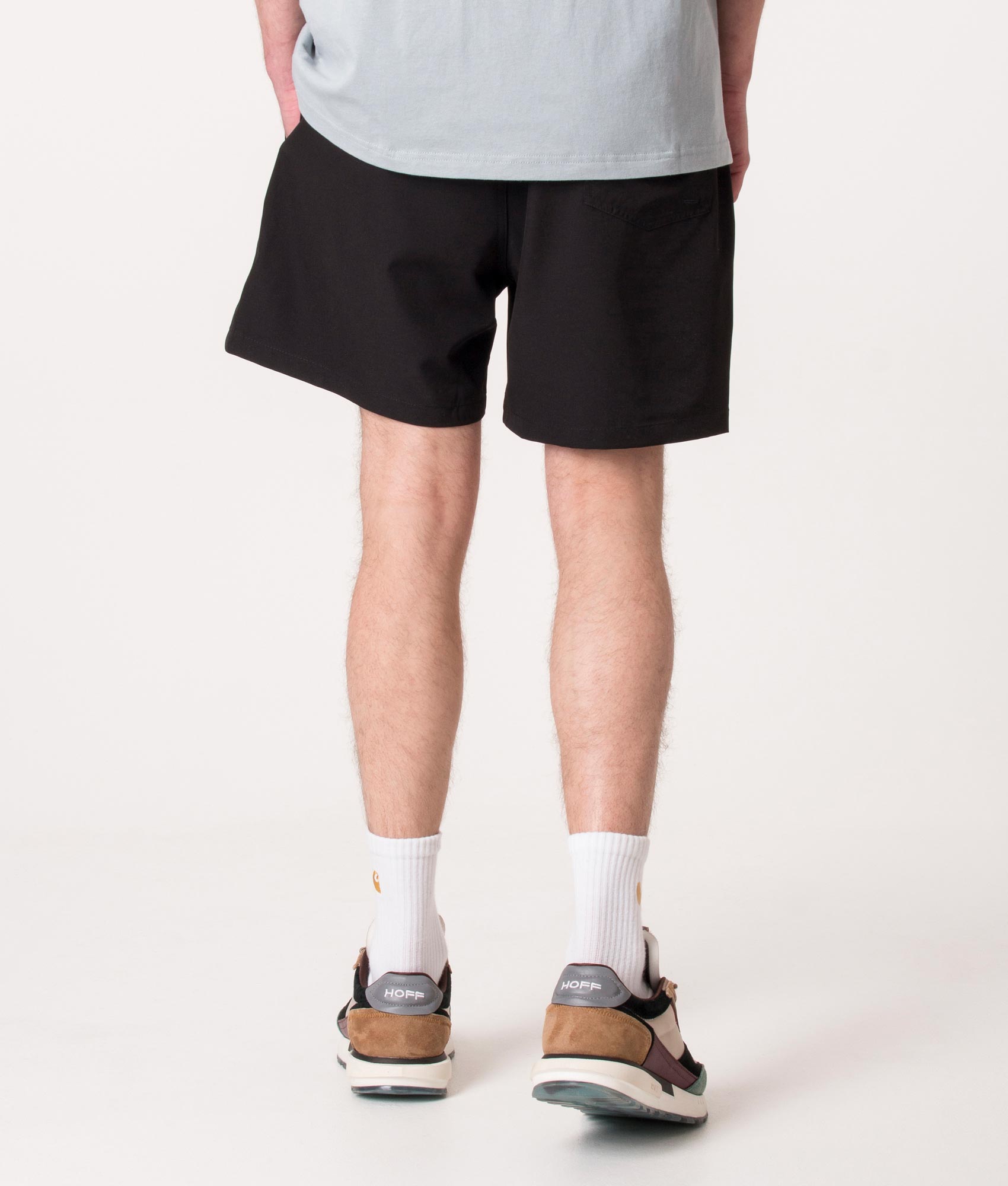Polo Ralph Lauren Regular Fit Traveler Mid Swim Shorts in Polo Black at EQVVS Menswear. Model back shot.