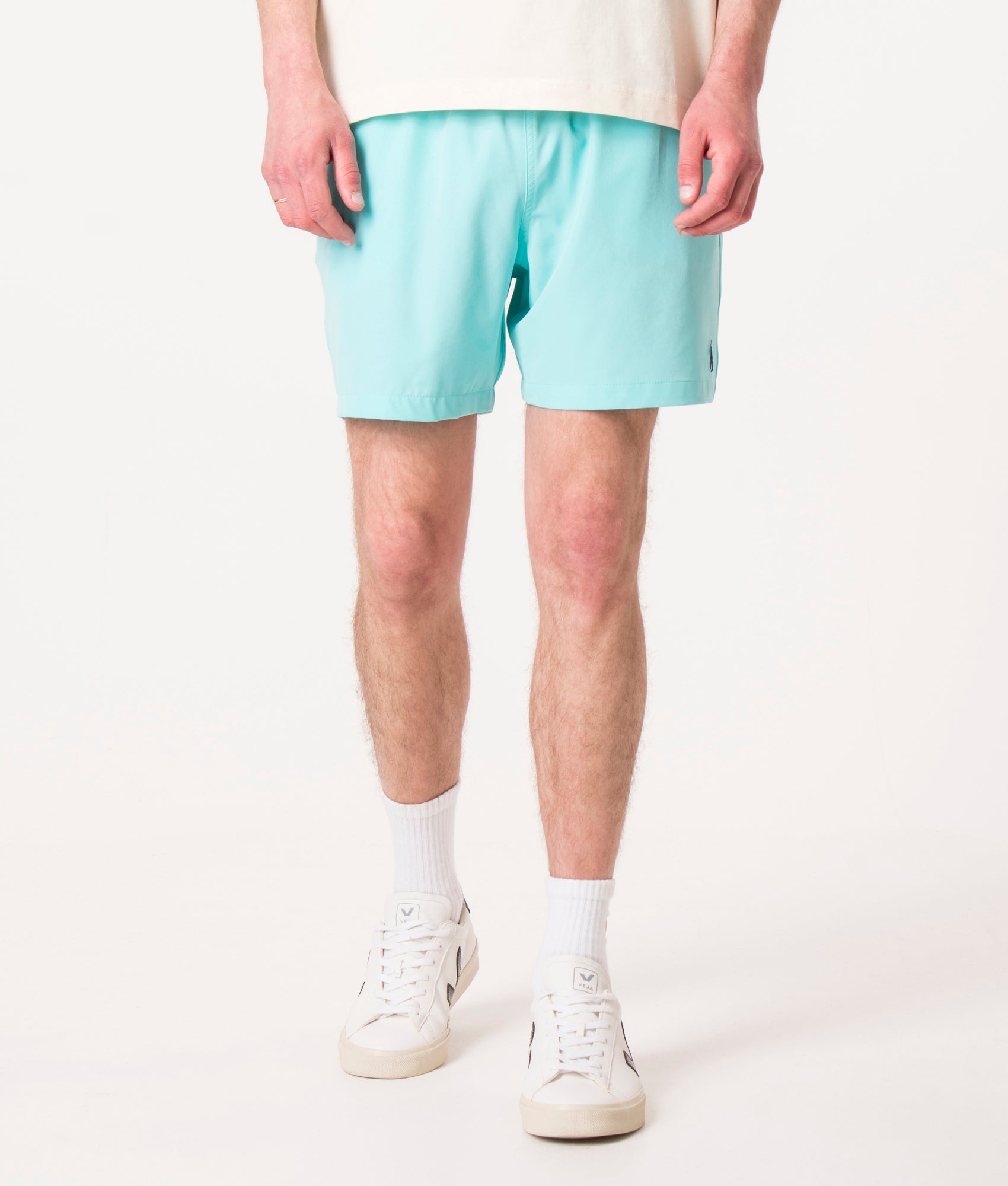 Polo Ralph Lauren Regular Fit Traveler Mid Swim Shorts in Hammond Blue at EQVVS Menswear. Model front shot.