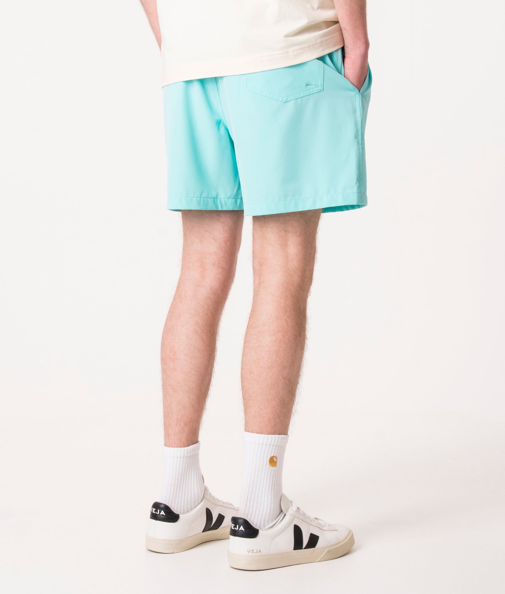Polo Ralph Lauren Regular Fit Traveler Mid Swim Shorts in Hammond Blue at EQVVS Menswear. Angled model back shot.