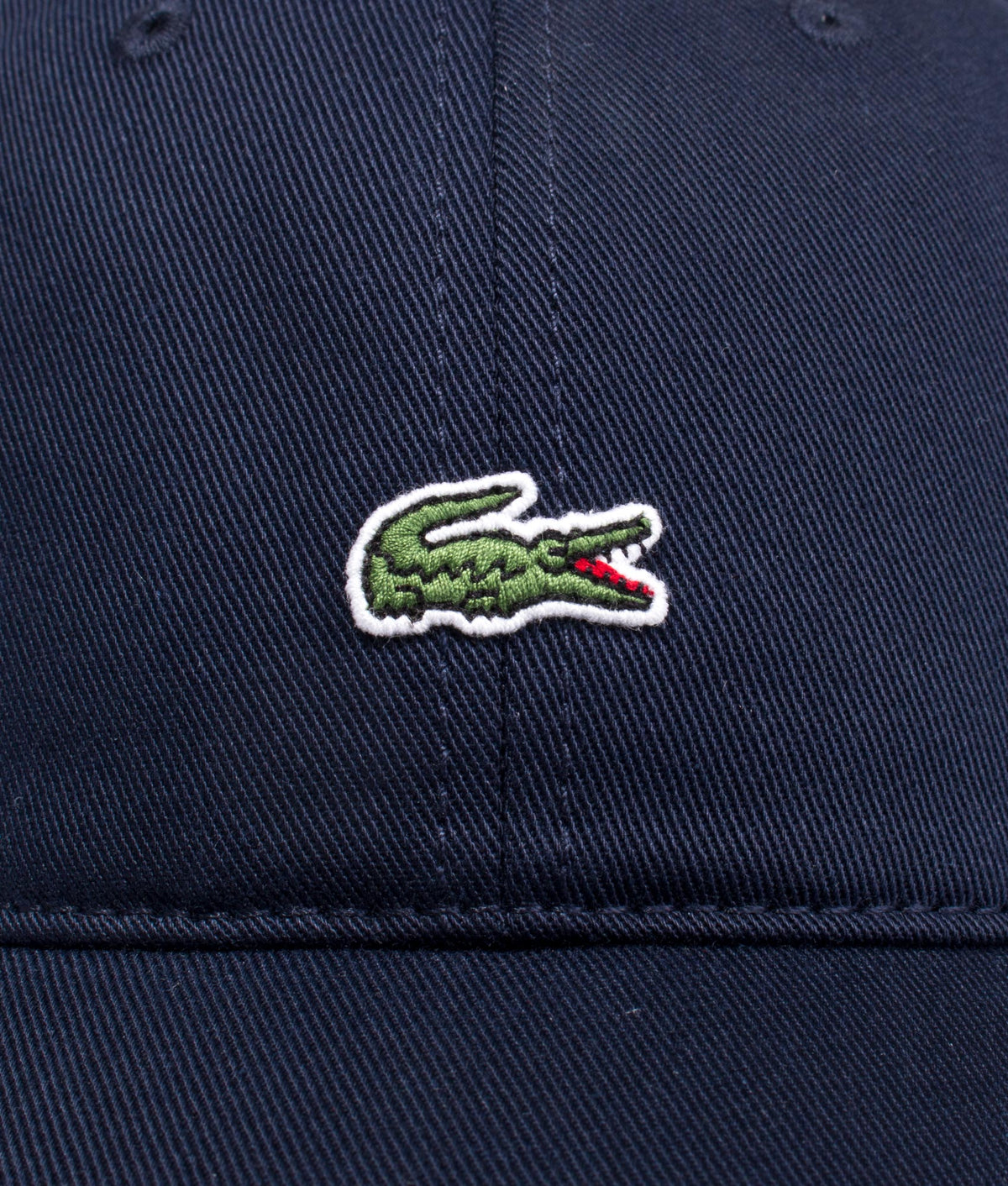 Lacoste Crocodile Cap in Navy Blue at EQVVS Menswear. Detail shot.