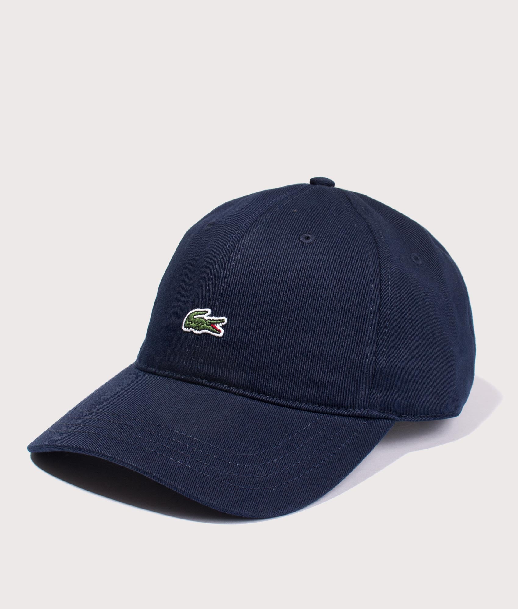 Lacoste Crocodile Cap in Navy Blue at EQVVS Menswear. Angled front shot.