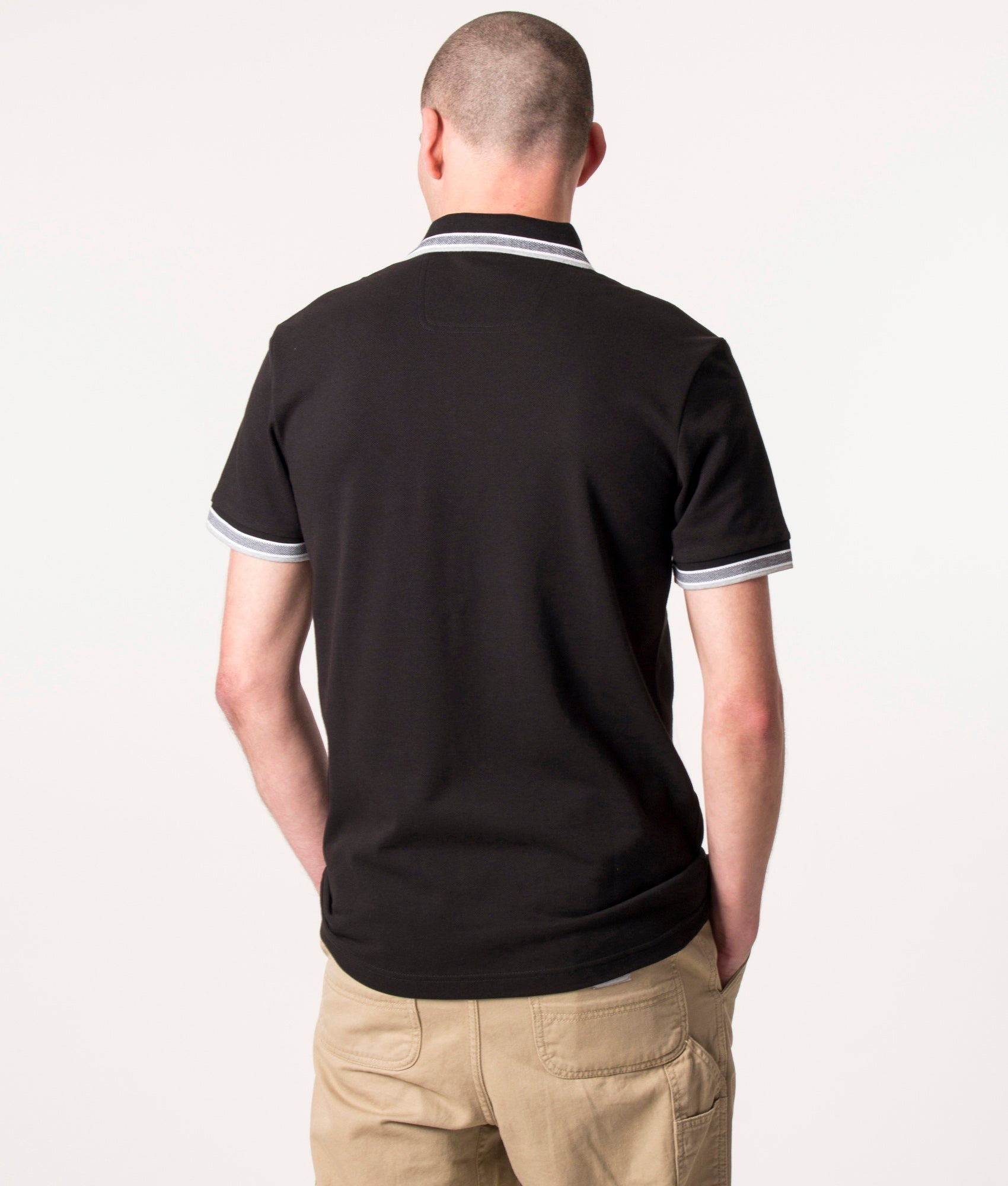 BOSS Paddy Polo Shirt in Black at EQVVS Menswear. Model Back shot.