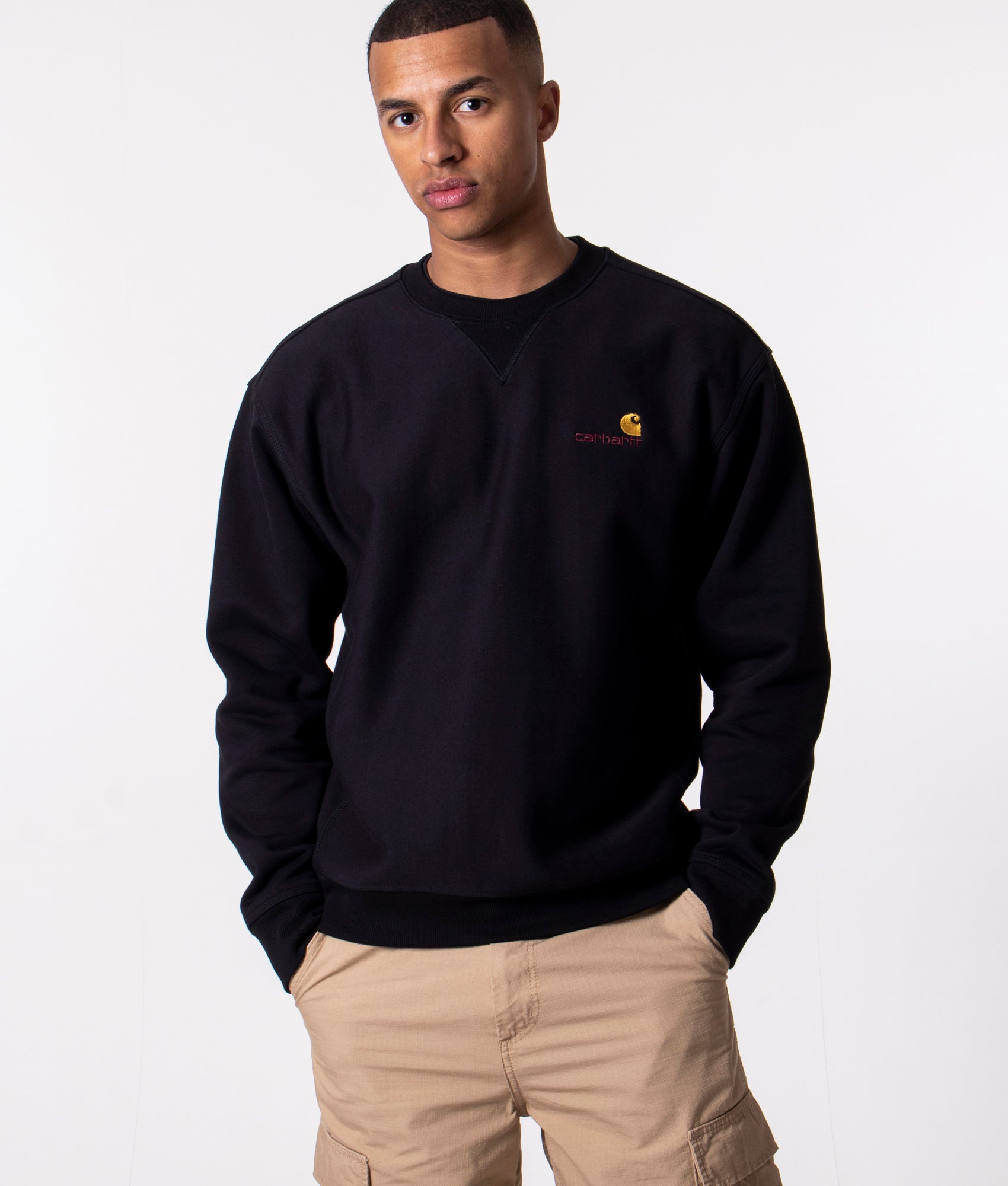 Carhartt WIP Relaxed Fit-American Script Sweatshirt in Black at EQVVS Menswear. Model front shot.
