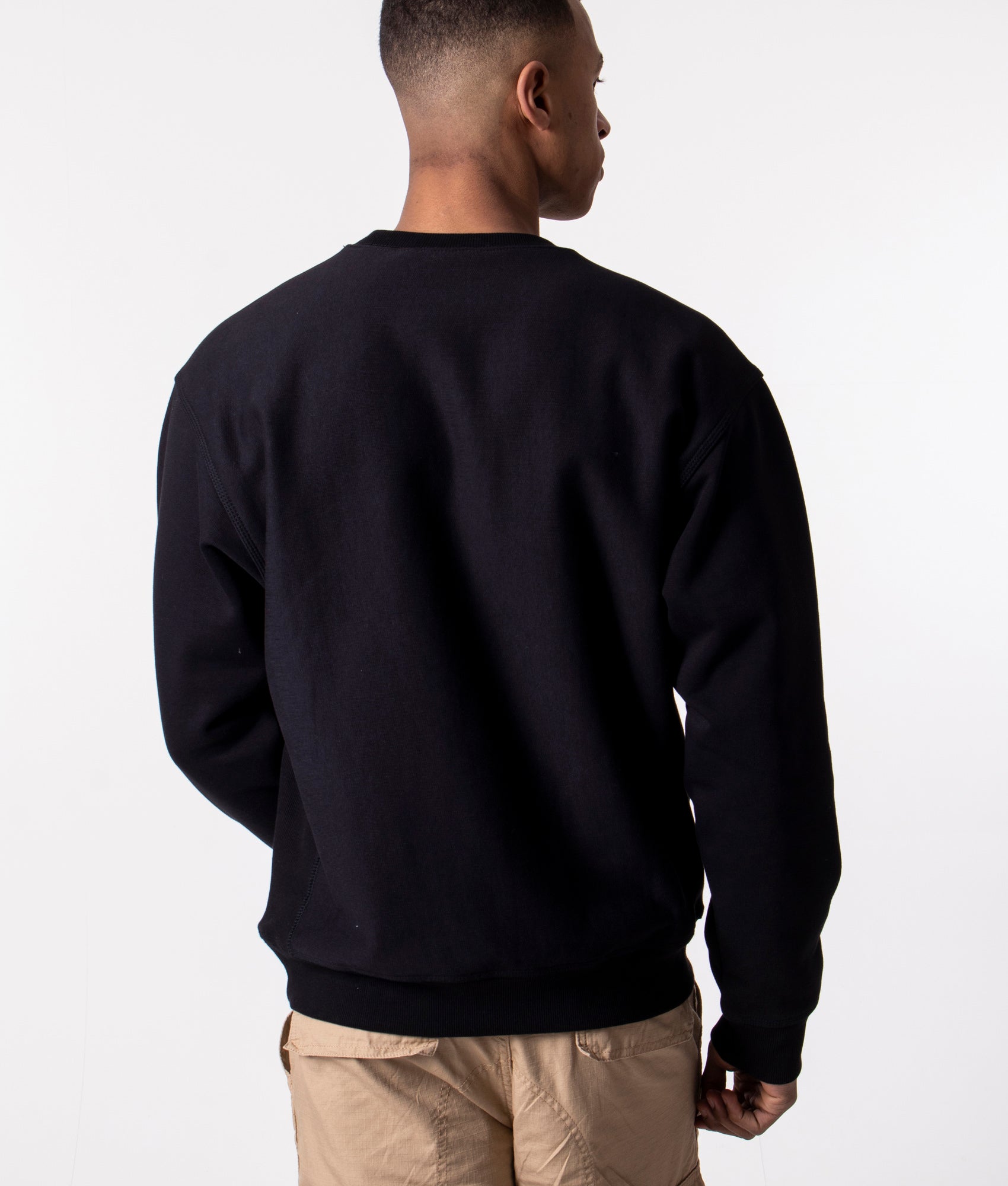 Carhartt WIP Relaxed Fit-American Script Sweatshirt in Black at EQVVS Menswear. Model back shot.