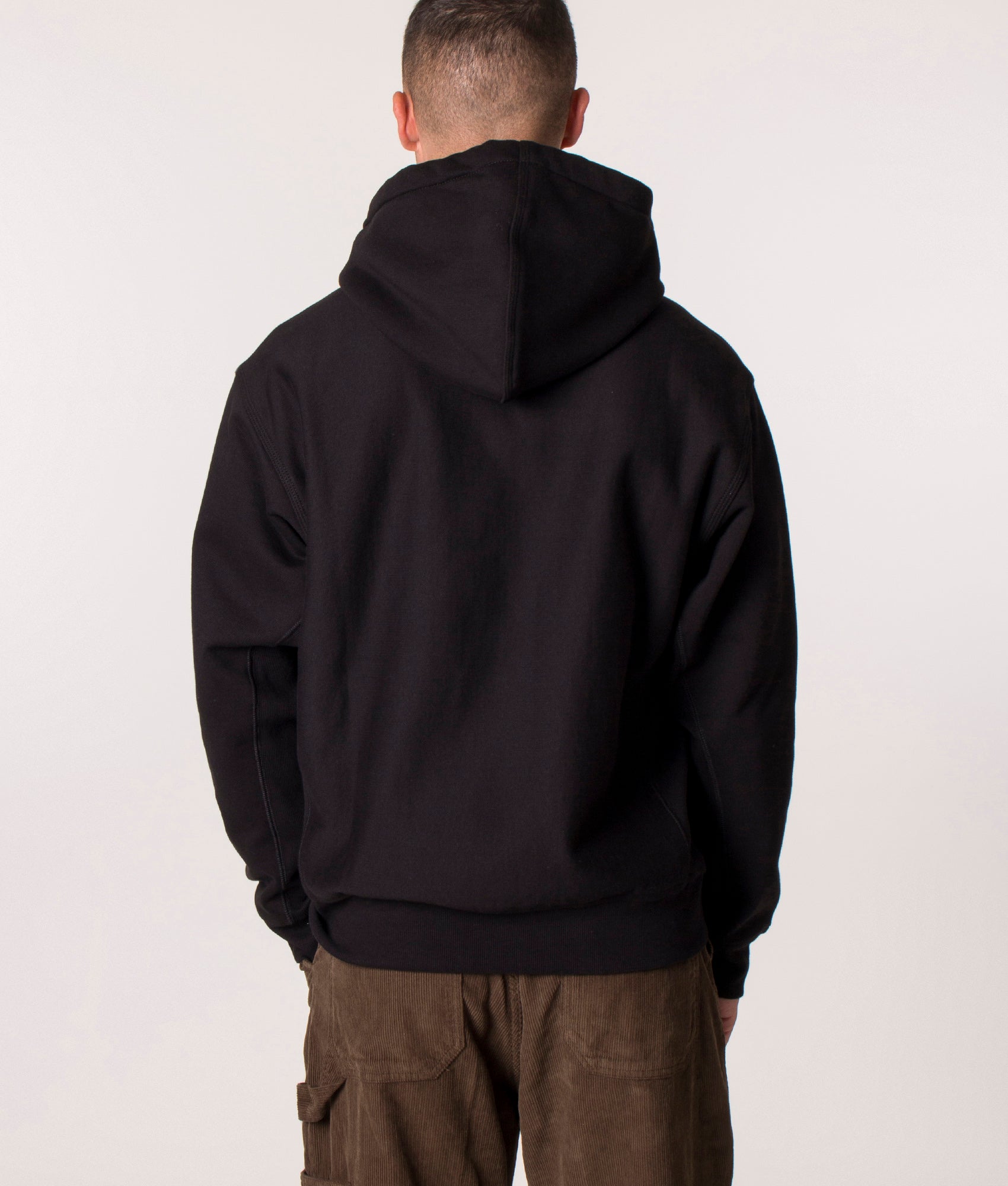 Carhartt WIP Loose Fit American Script Hoodie in Black at EQVVS Menswear. Back shot.