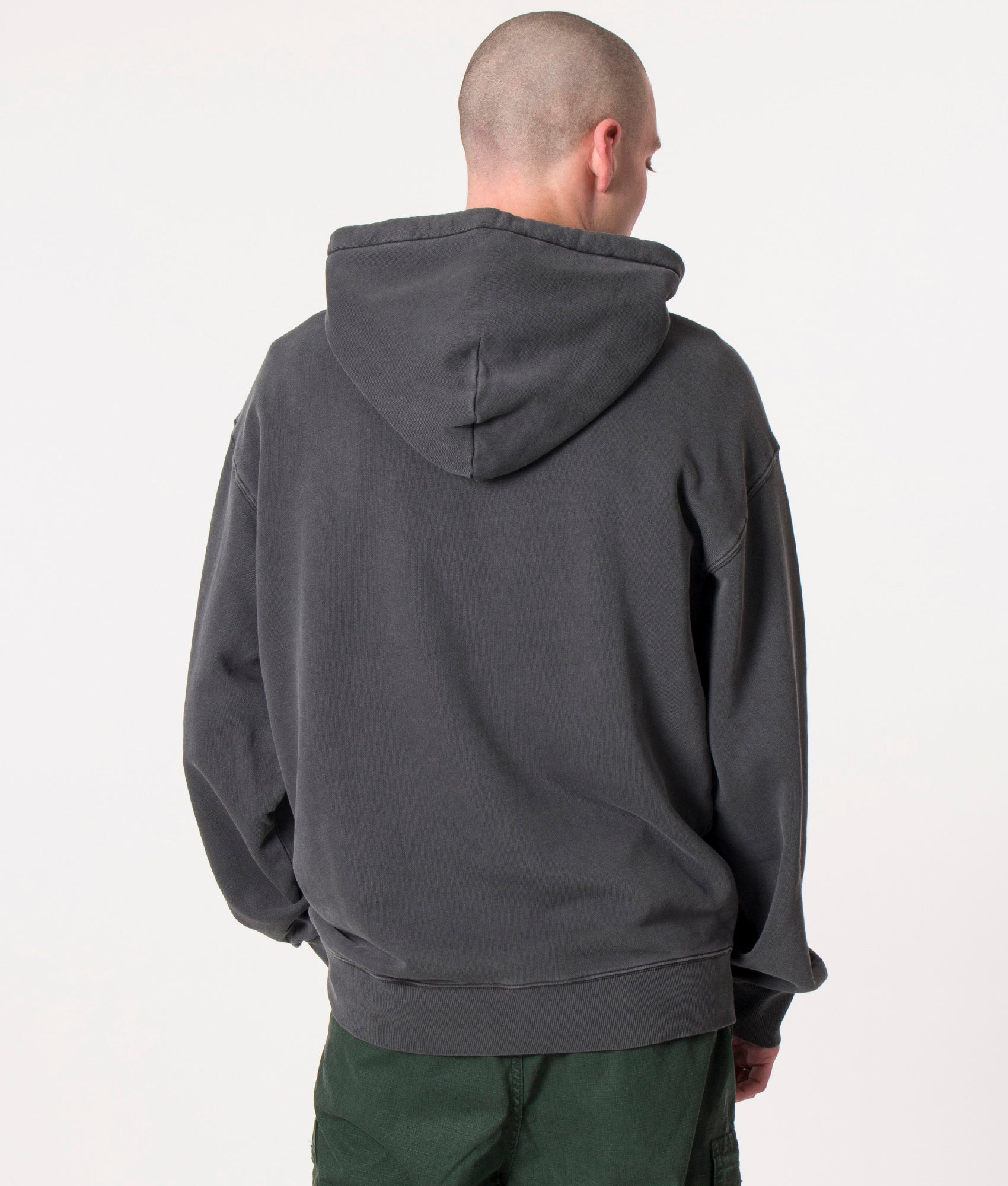 Carhartt WIP Oversized Nelson Hoodie  in Black at EQVVS Menswear. Model back shot.