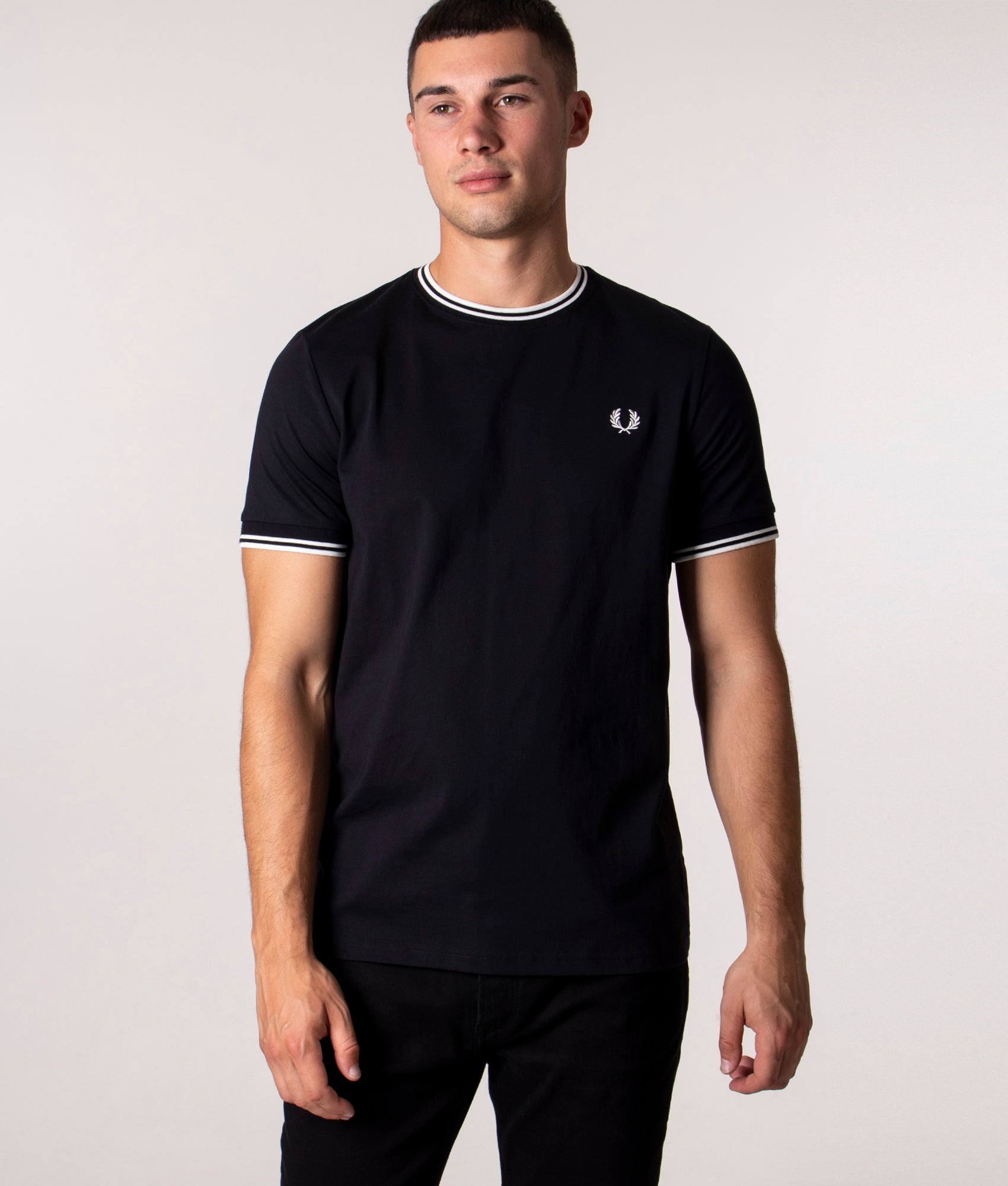 Fred Perry Twin Tipped T-Shirt in Core Black at EQVVS Menswear. Model front shot.