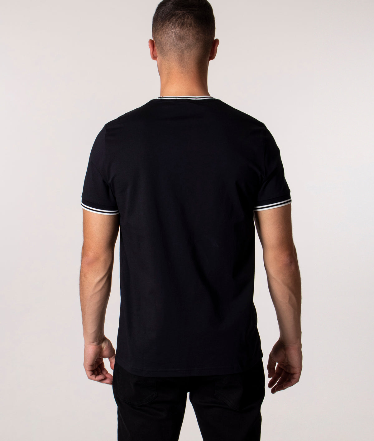 Fred Perry Twin Tipped T-Shirt in Core Black at EQVVS Menswear. Model back shot.