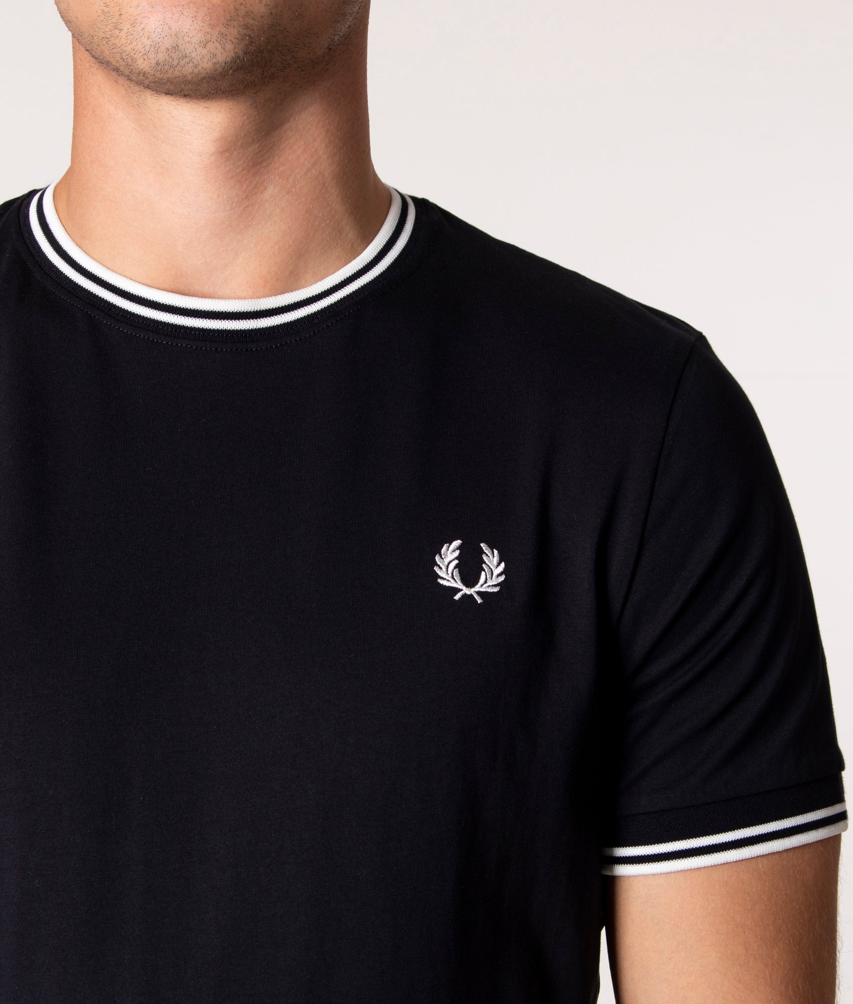 Fred Perry Twin Tipped T-Shirt in Core Black at EQVVS Menswear. Detail shot.