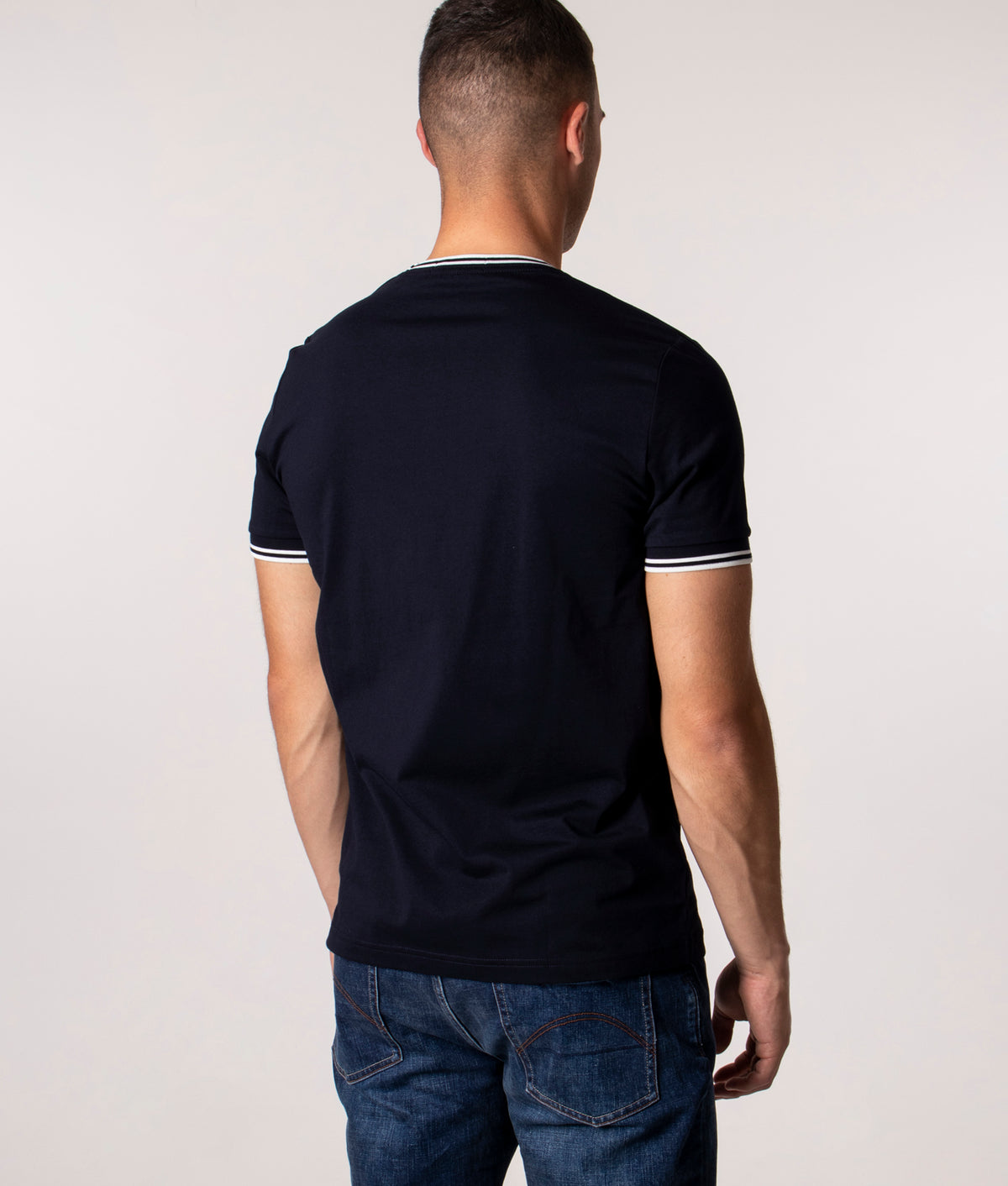 Fred Perry Twin Tipped T-Shirt in Core Navy at EQVVS Menswear. Model back shot.