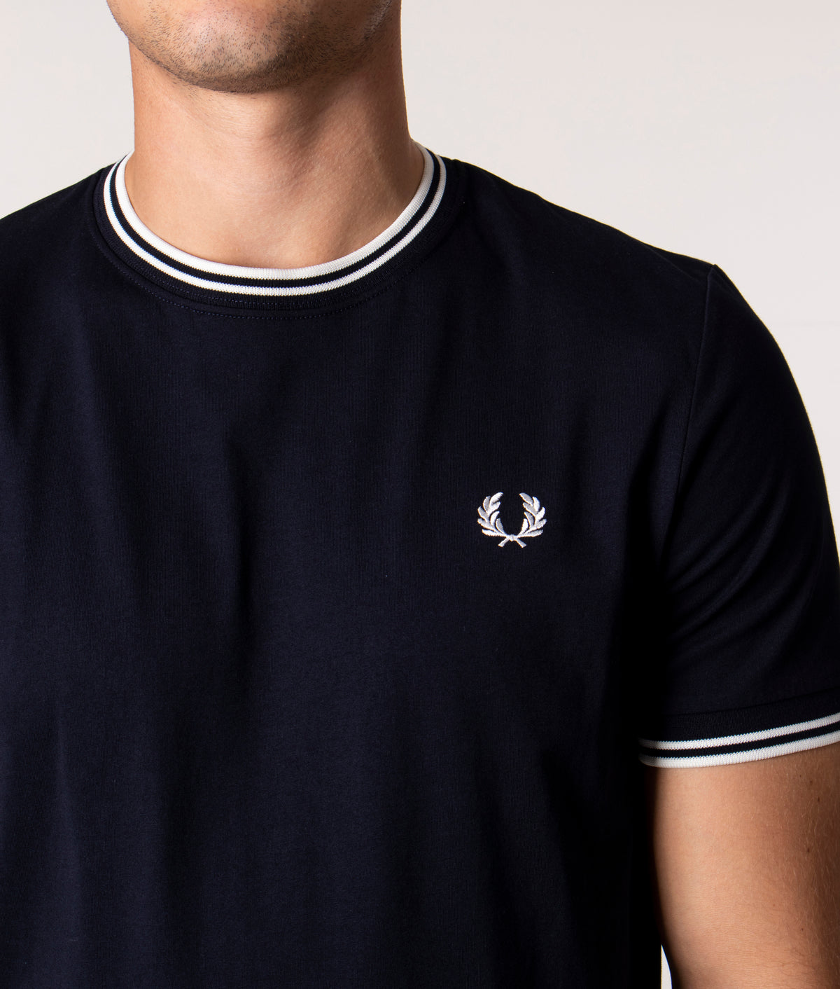 Fred Perry Twin Tipped T-Shirt in Core Navy at EQVVS Menswear. Detail shot.