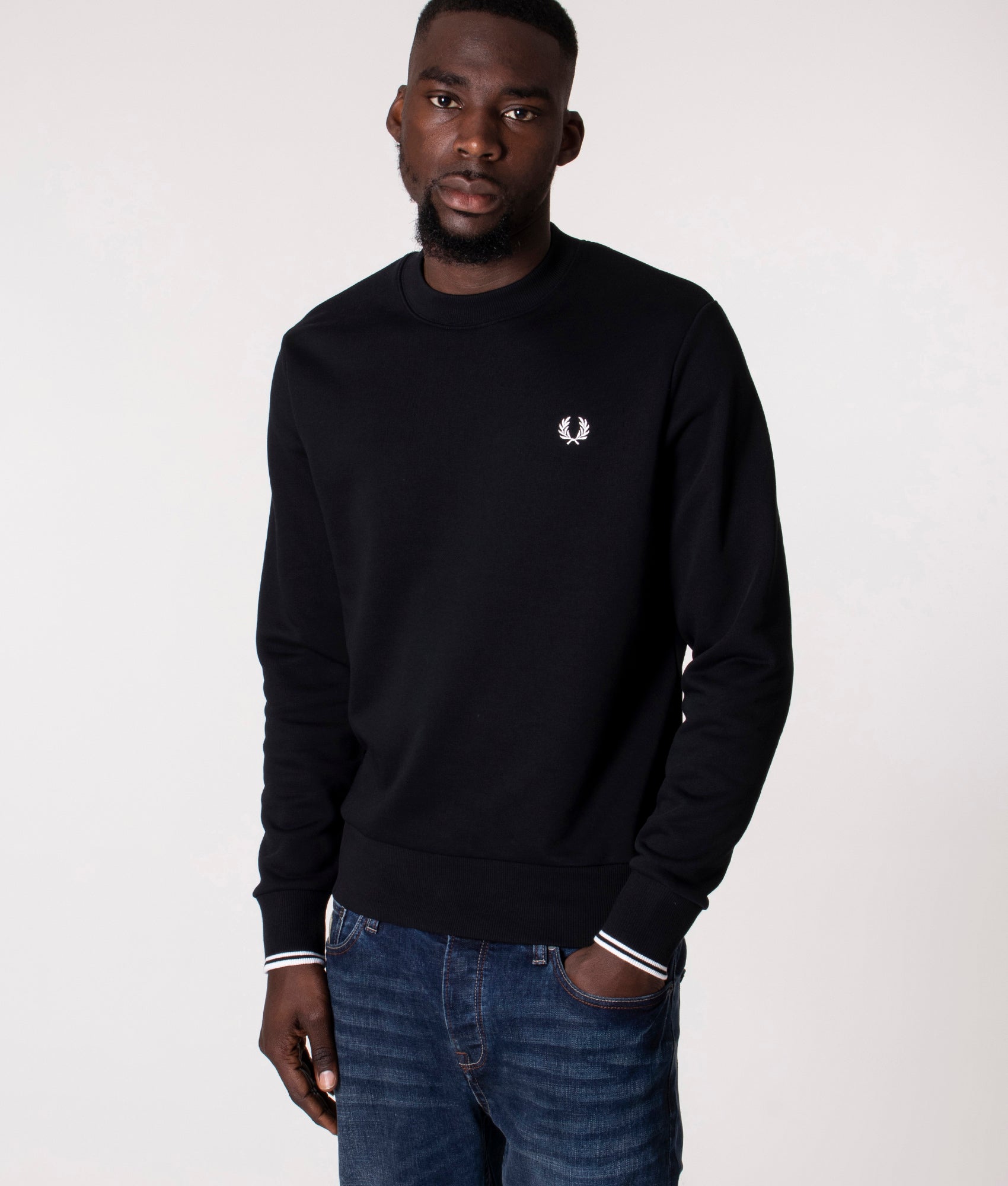 Fred Perry Crew Neck Sweatshirt in Core Black at EQVVS Menswear. Model front shot.