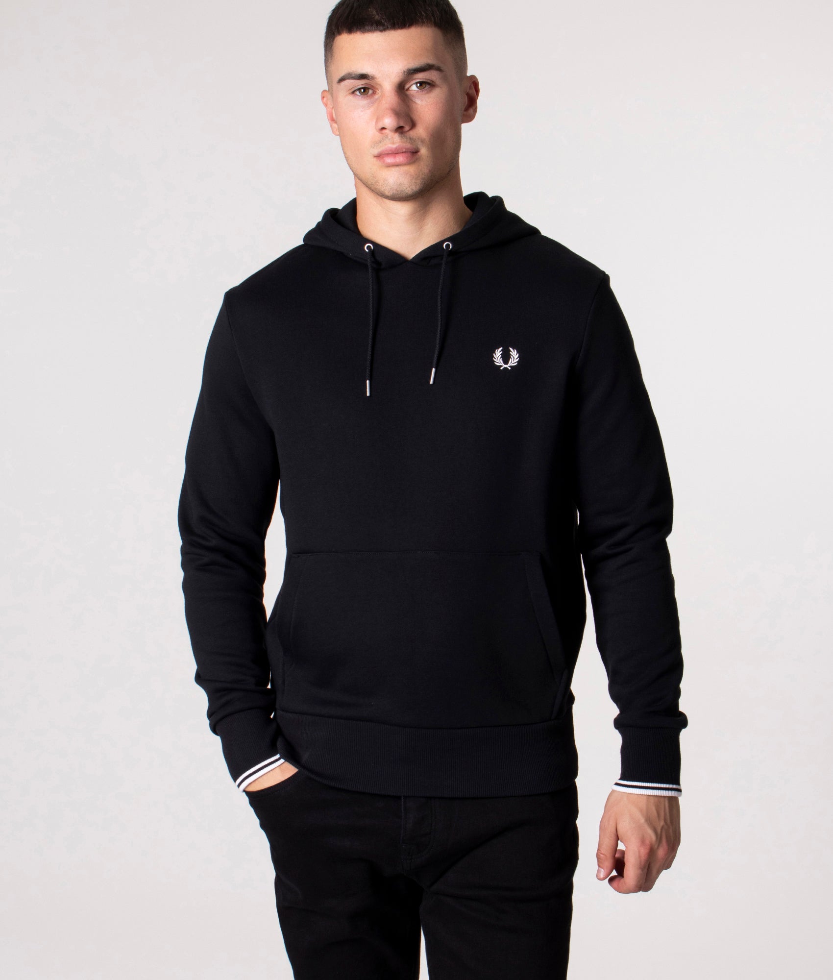 Fred Perry Twin Tipped Hoodie in Black at EQVVS Menswear. Model front shot.