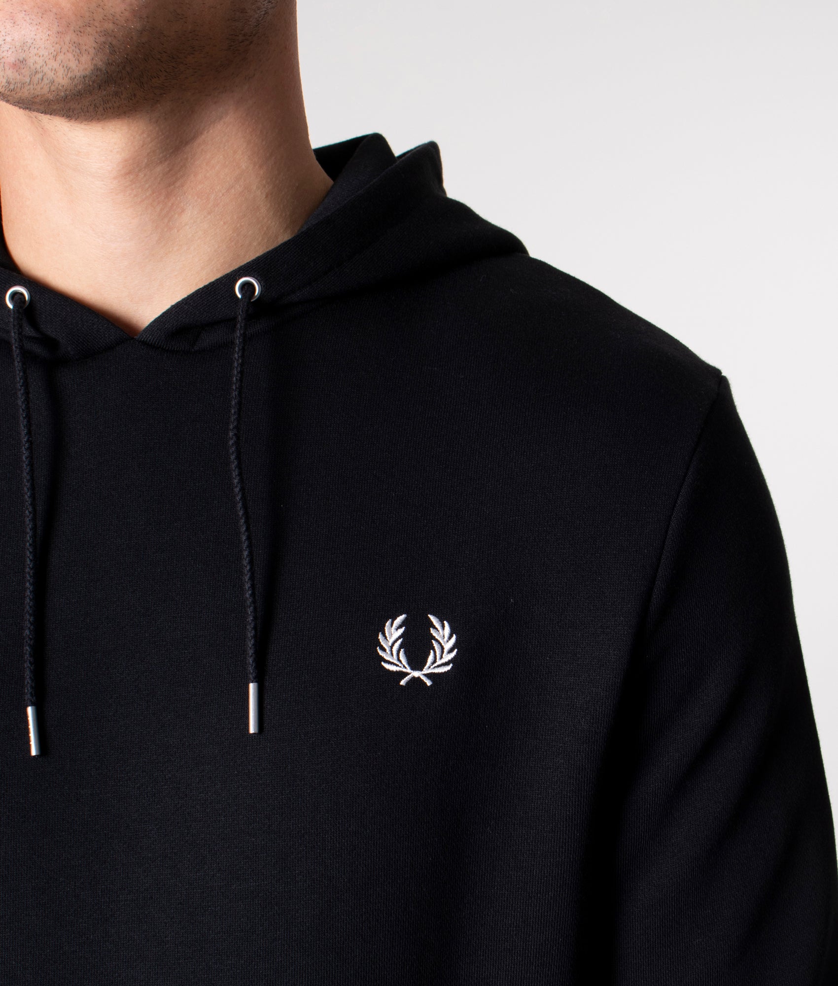 Fred Perry Twin Tipped Hoodie in Black at EQVVS Menswear. Detail shot.