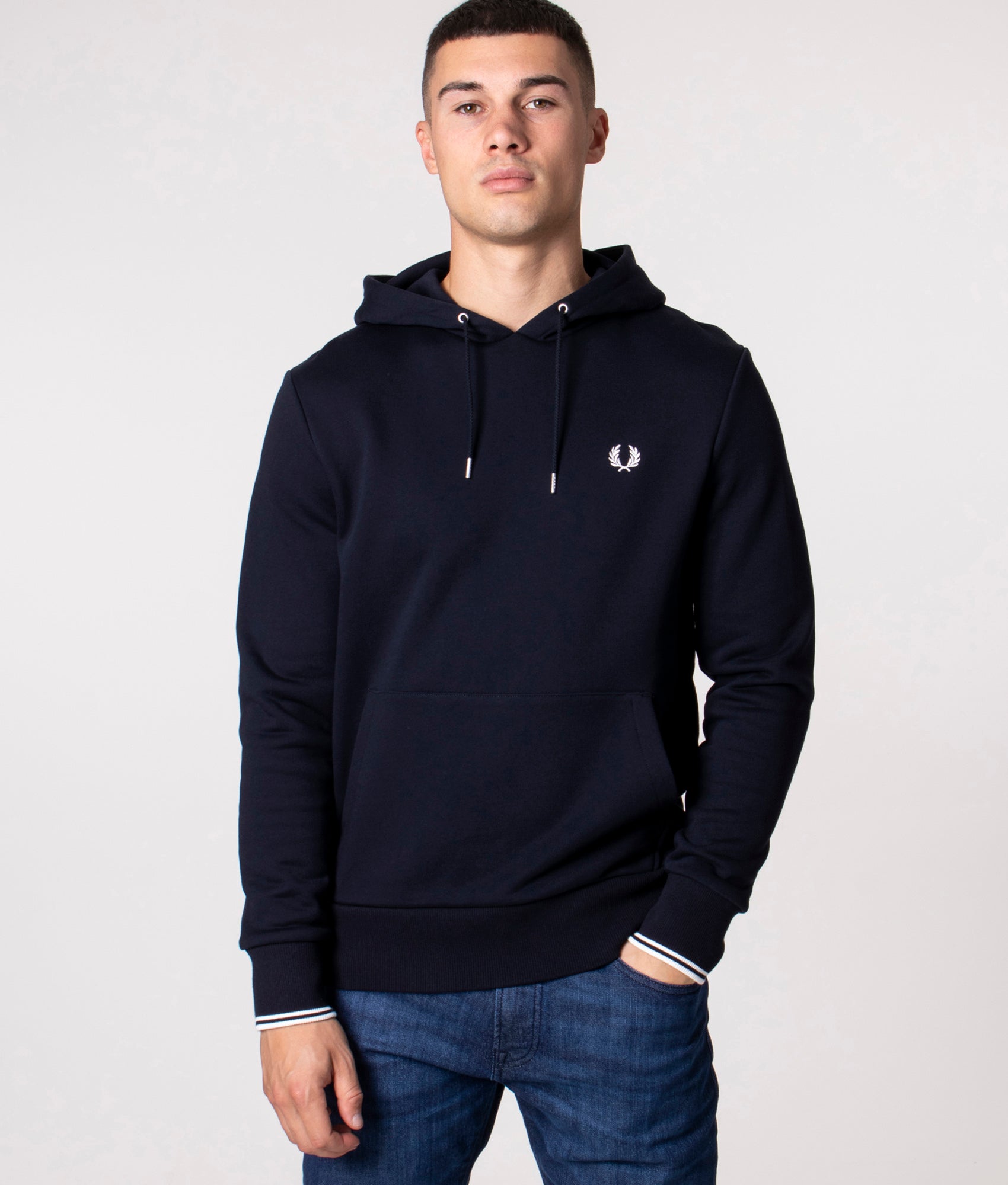 Fred Perry Twin Tipped Hoodie in Navy at EQVVS Menswear. Model shot.