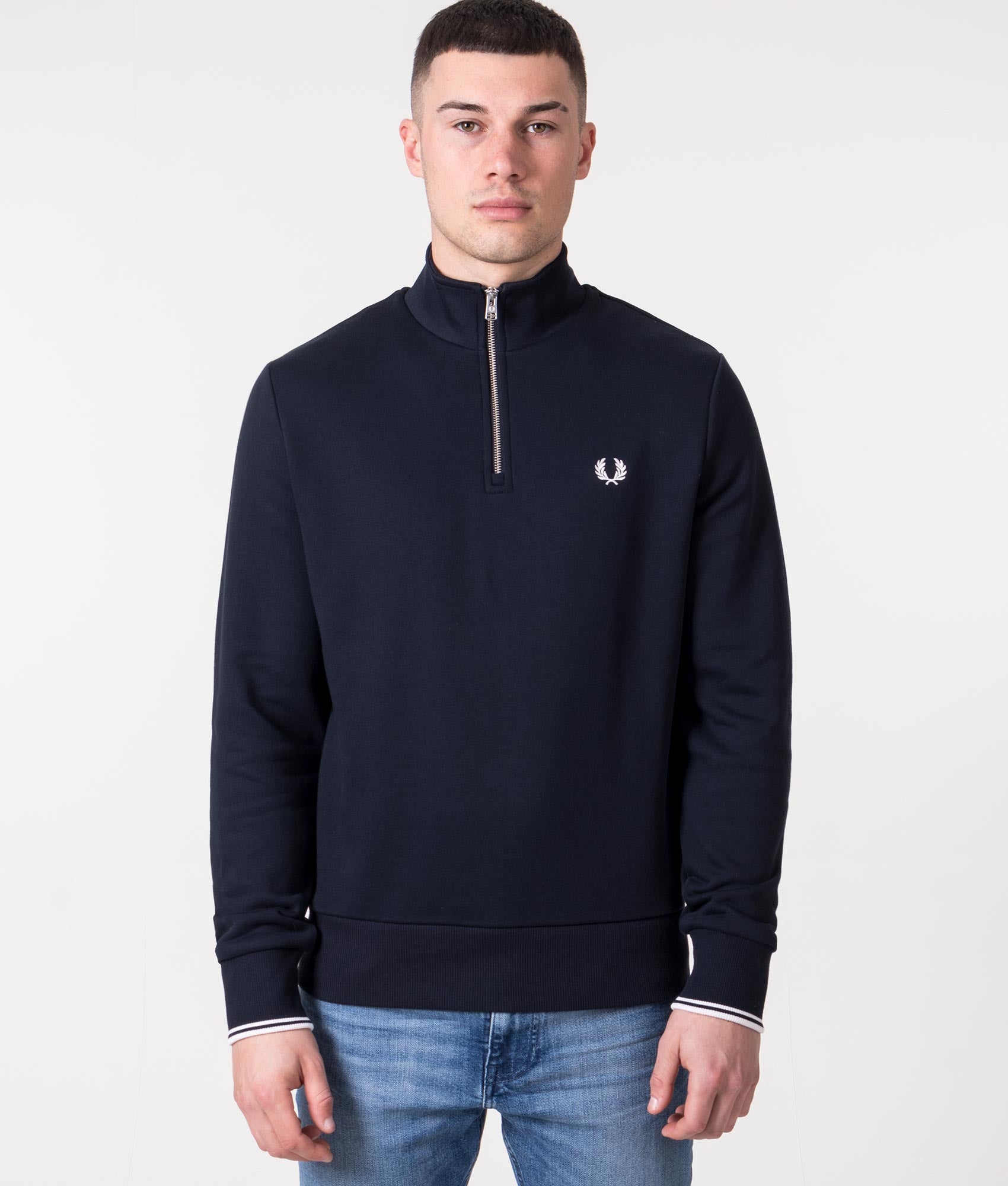 Fred Perry Quarter Zip Sweatshirt in Navy at EQVVS Menswear. Model front shot.