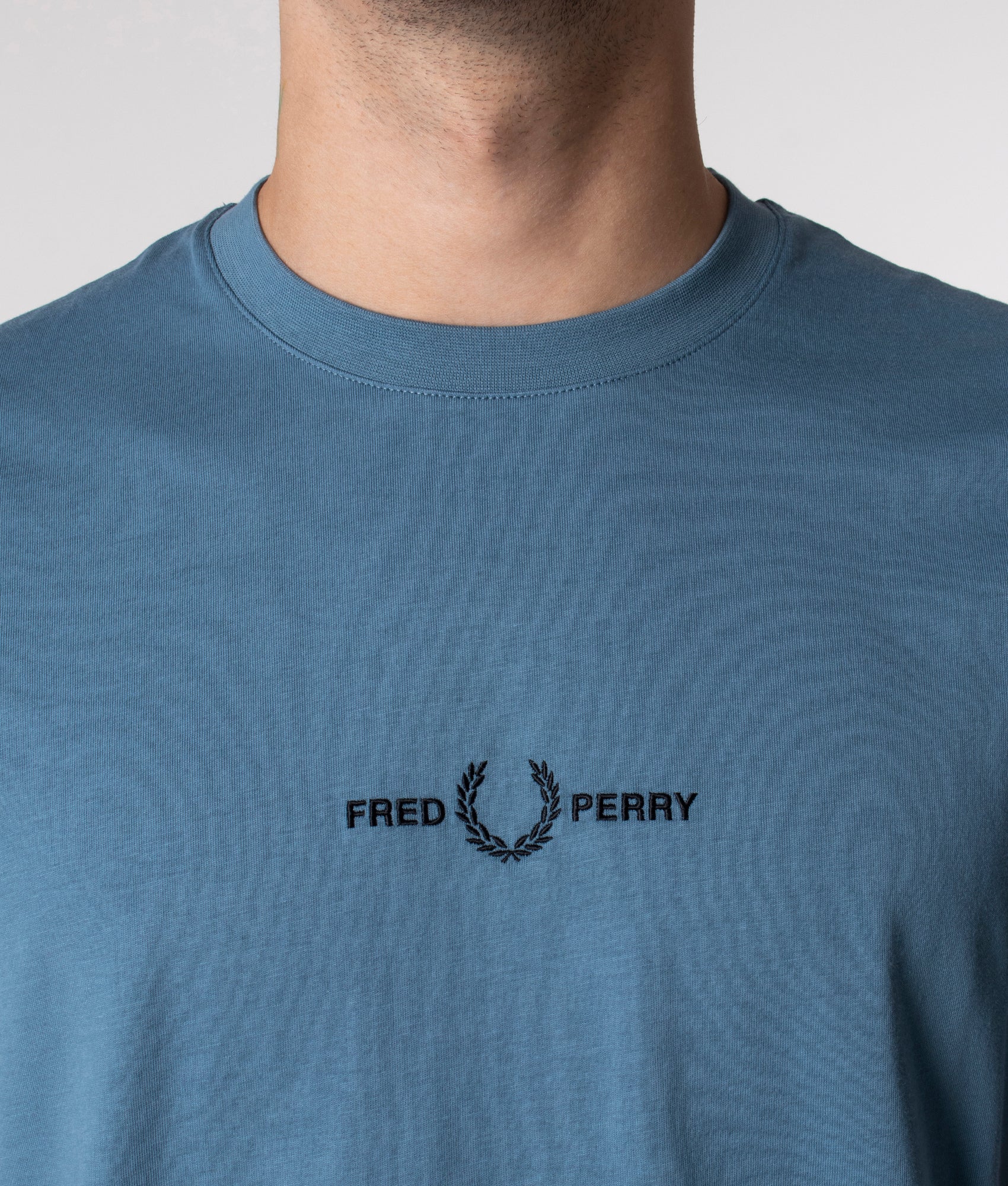 Fred Perry Embroidered T-Shirt in Ash Blue at EQVVS. Detail Shot. 