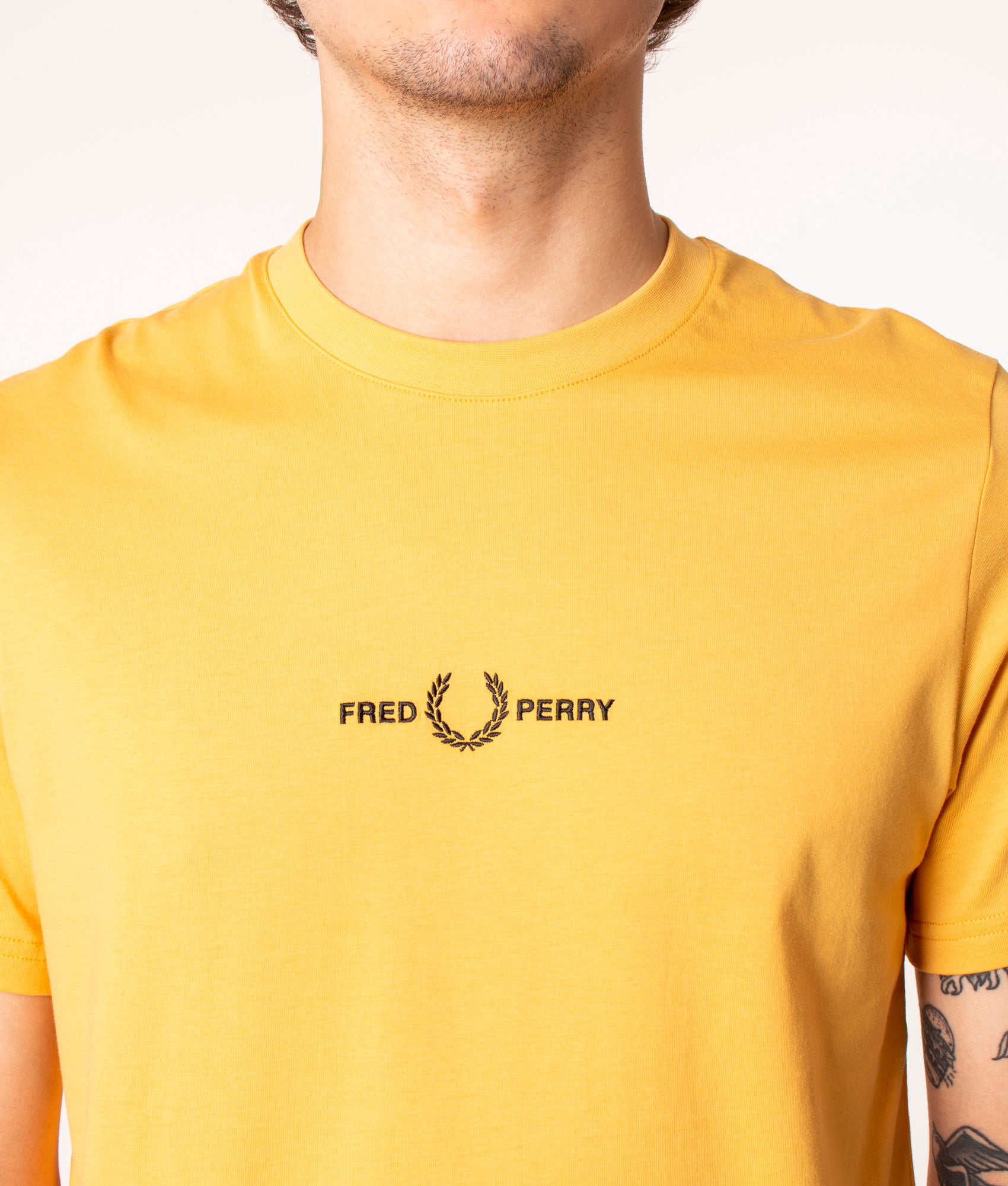 Fred Perry Embroidered T-Shirt in Yellow at EQVVS. Detail Shot. 