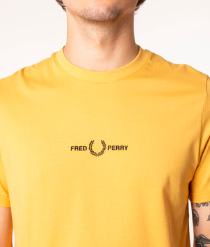 Fred Perry Embroidered T-Shirt in Yellow at EQVVS. Detail Shot. 