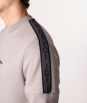 Fred Perry Tape Sleeve Sweatshirt in Concrete at EQVVS, Model, shoulder detail