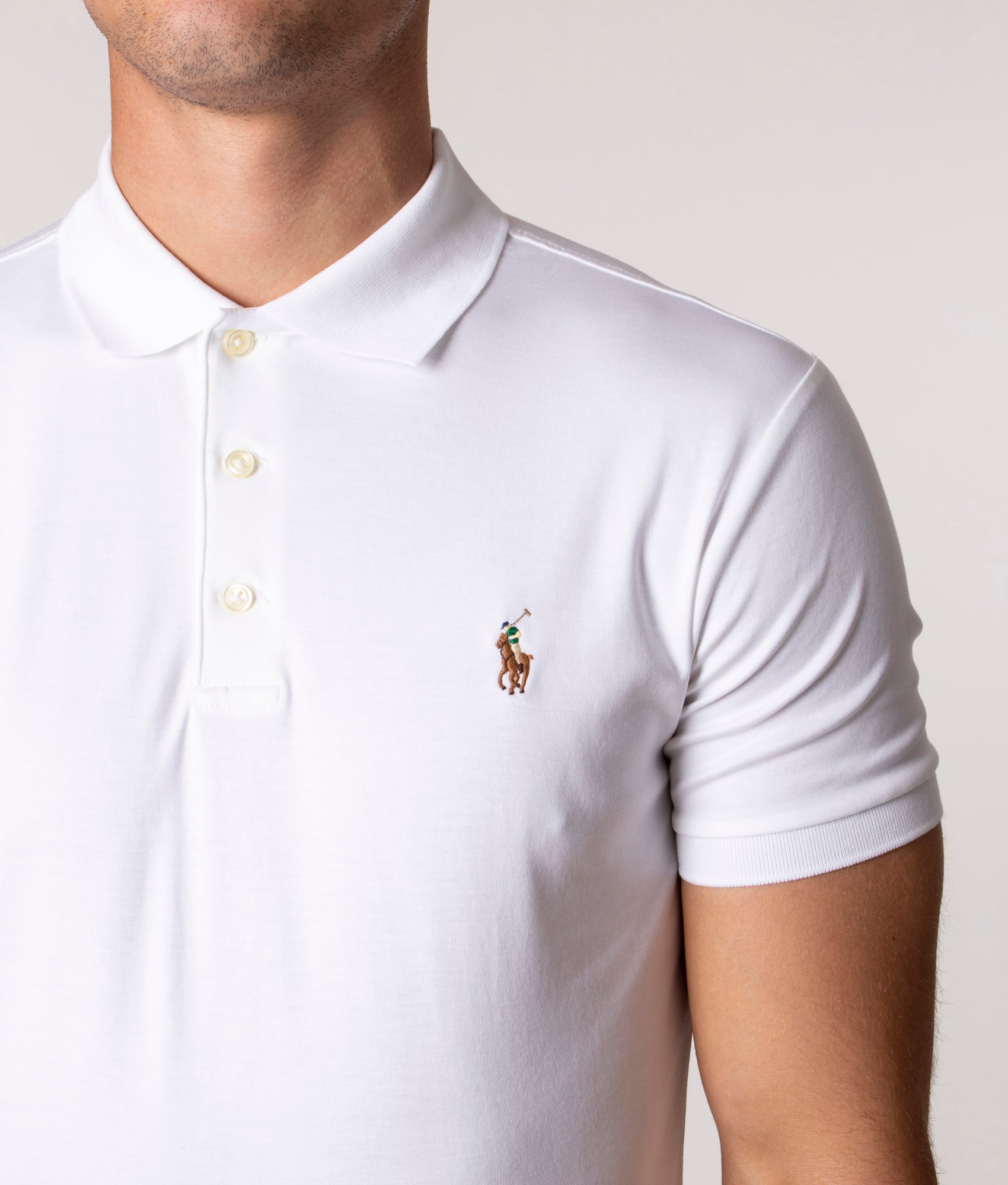 Polo Ralph Lauren Slim Fit Soft Touch Pima Polo Shirt in core 001 White at EQVVS Menswear. Model detail shot. 