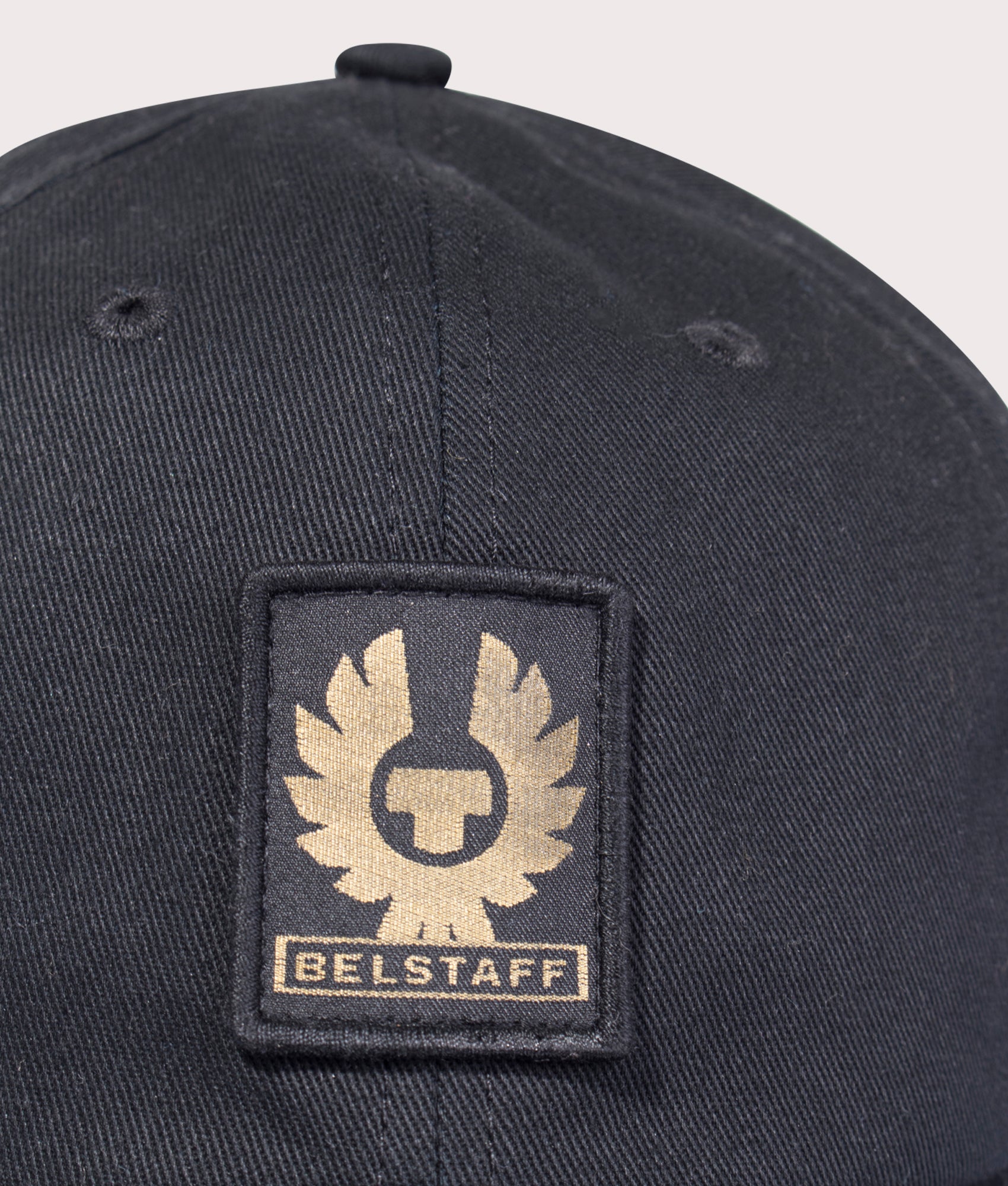 Belstaff Phoenix Logo Cap in Black at EQVVS Menswear. Detail shot.