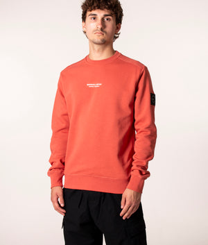Marshall Artist Siren Crew Sweatshirt in Rust at EQVVS. Model, angle.