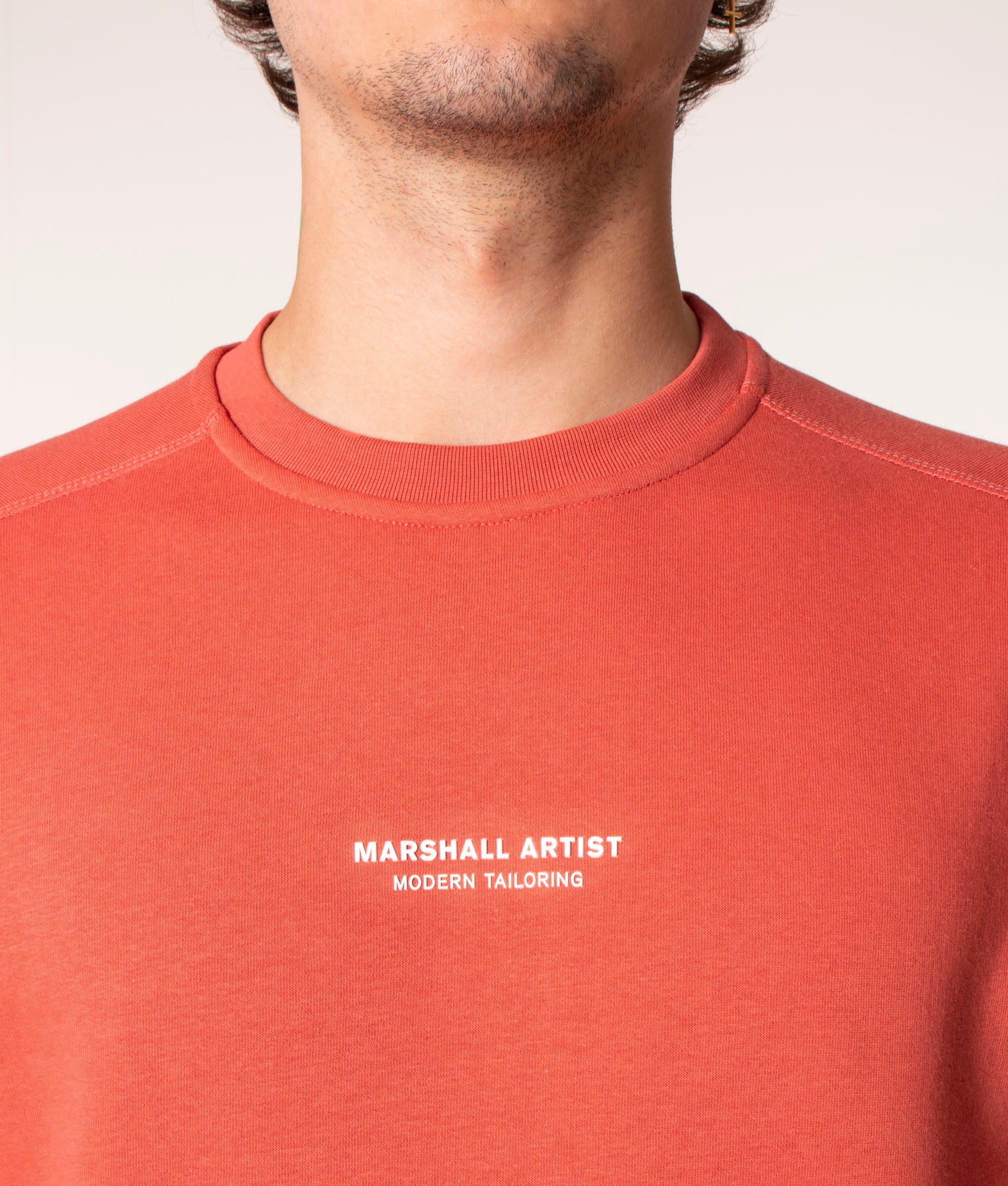 Marshall Artist Siren Crew Sweatshirt in Rust at EQVVS. Model, detail. 
