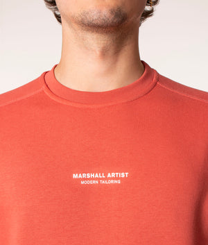 Marshall Artist Siren Crew Sweatshirt in Rust at EQVVS. Model, detail. 