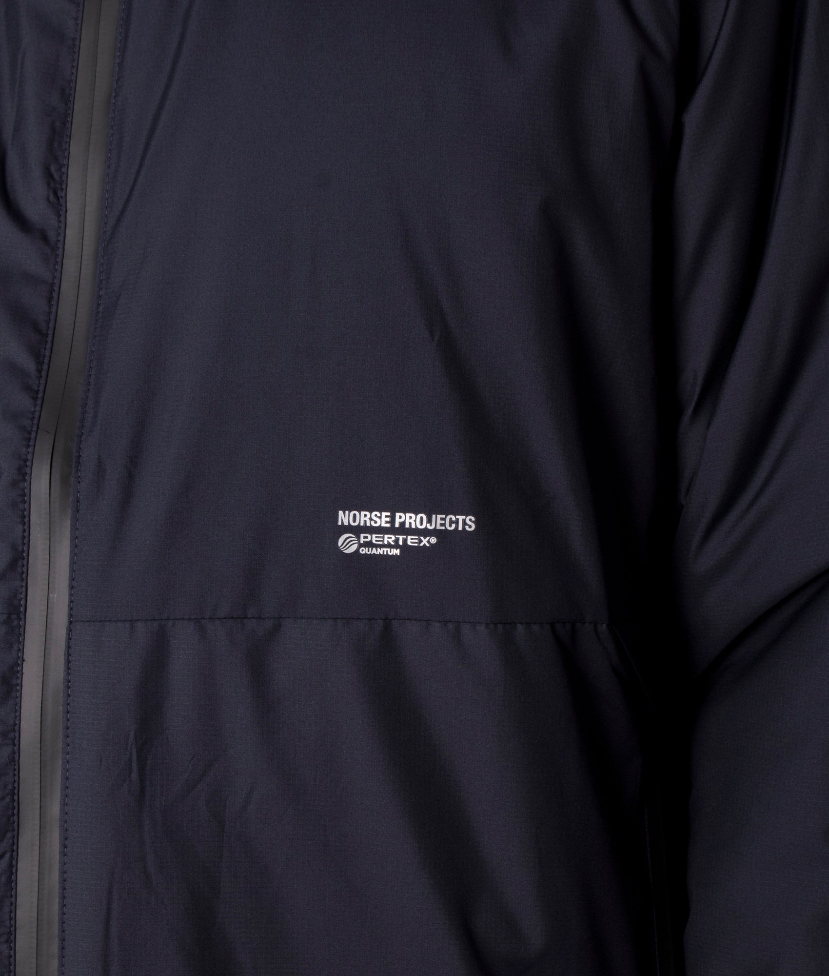 Norse Projects Alta Light Pertex Jacket in Navy Blue, EQVVS. Model, detail. 