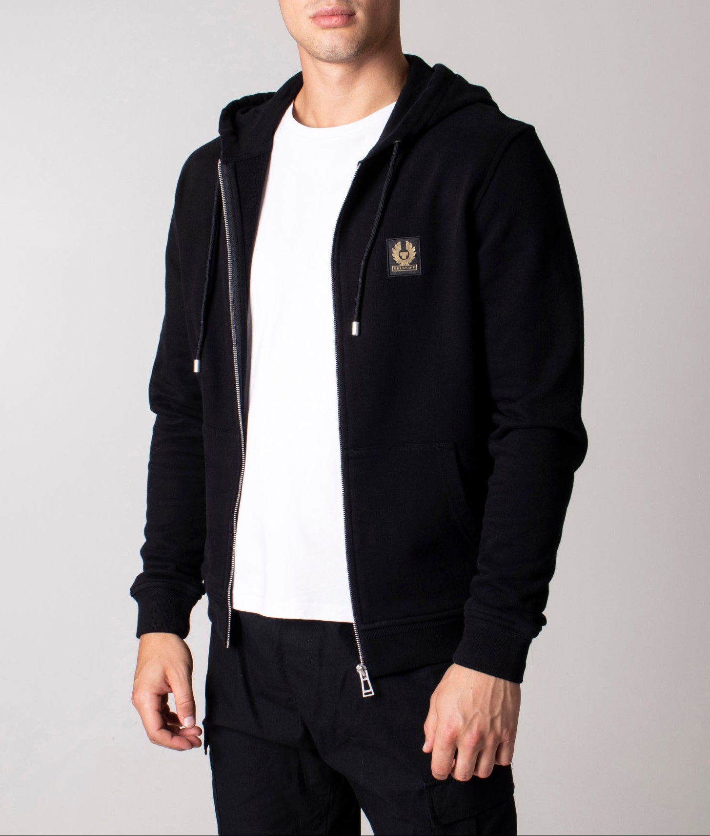 Belstaff Full Zip Hoodie in Black at EQVVS Menswear. Model front shot.