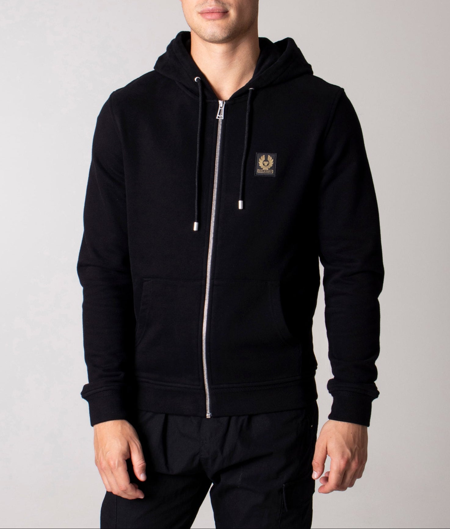Belstaff Full Zip Hoodie in Black at EQVVS Menswear. Model front shot.