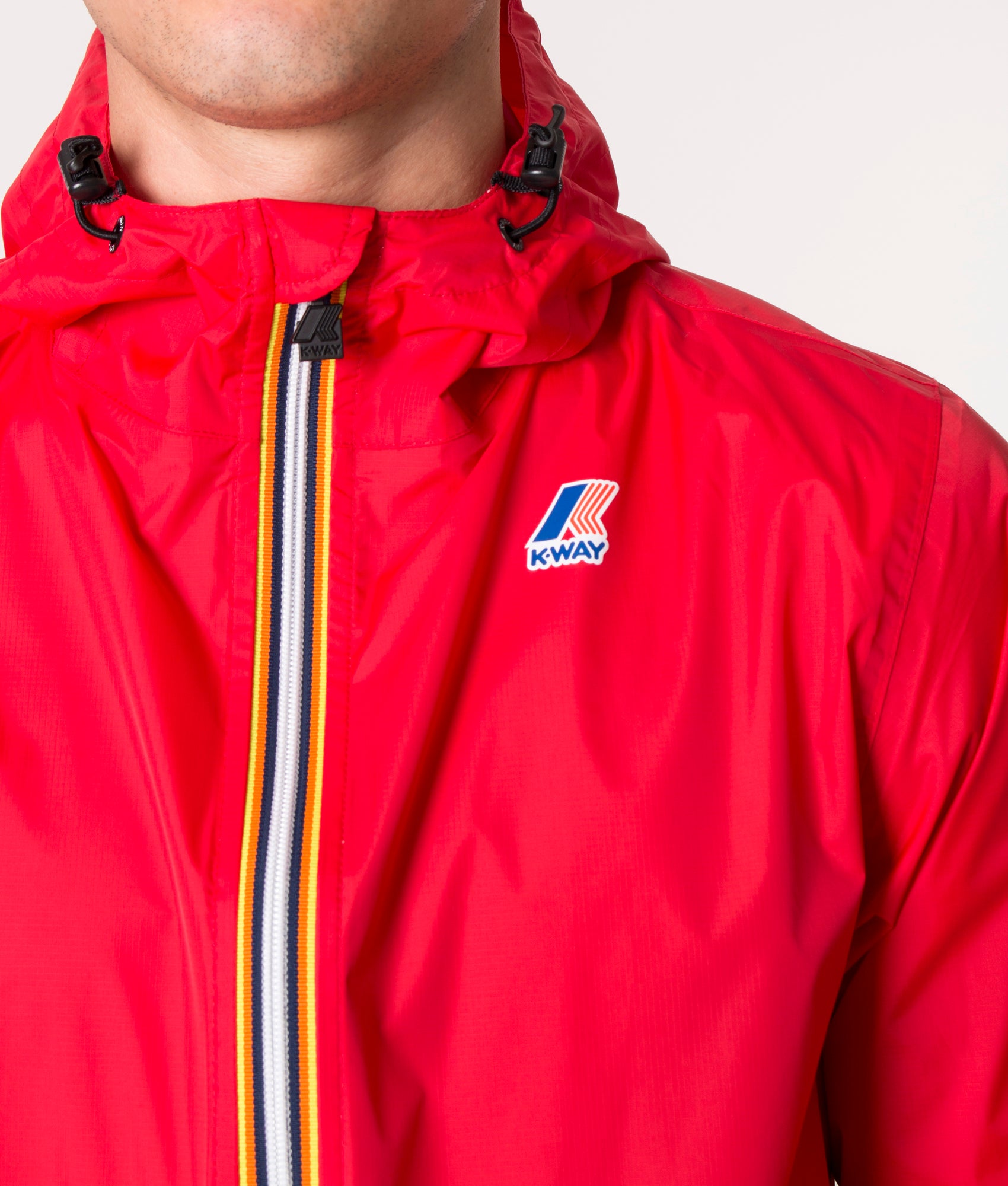 Le Vrai 3.0 Claude Jacket in Q03 Red by K-Way at EQVVS. Model detail image