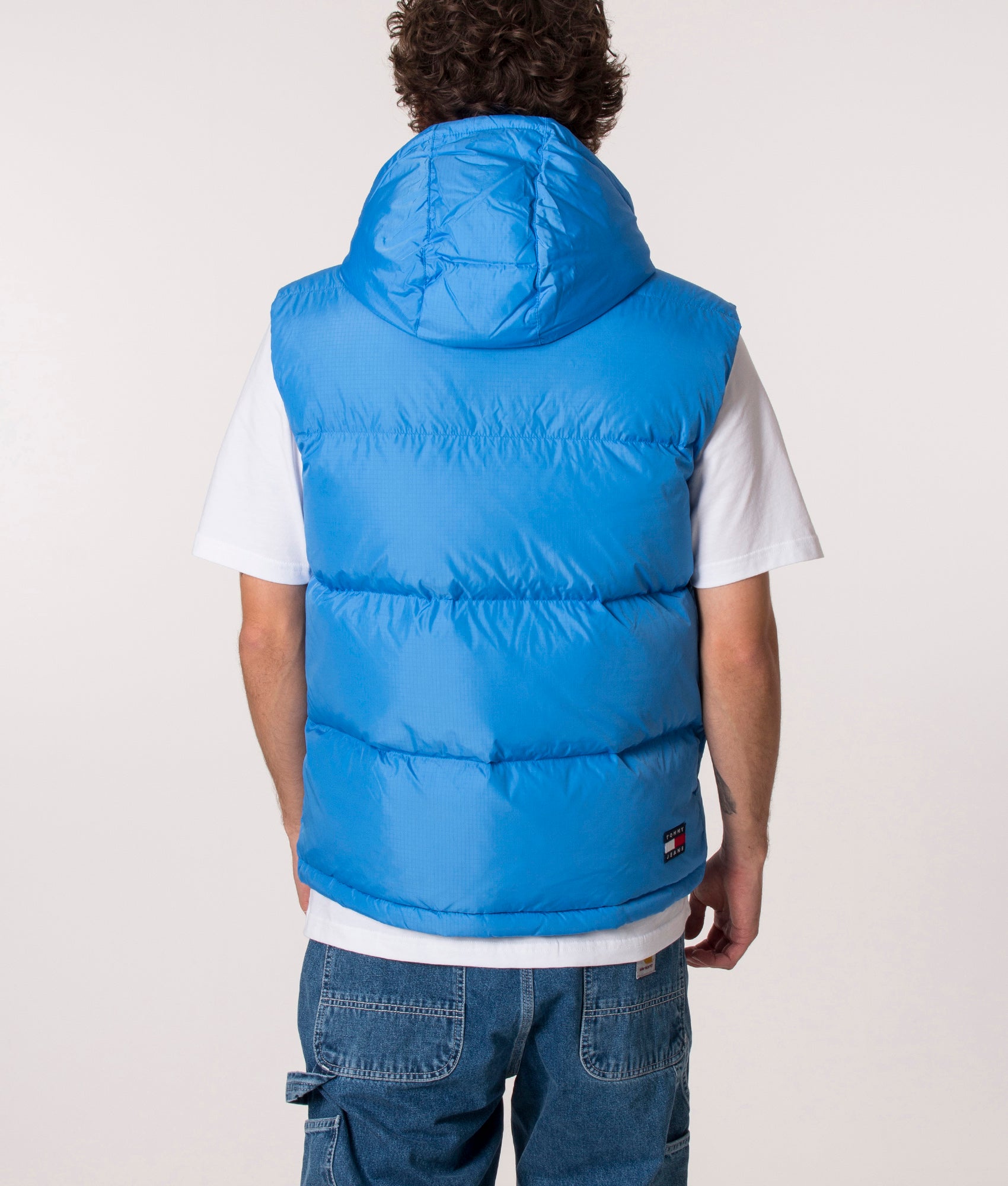 Alaska Gilet in Mesmerising Blue by Tommy Jeans at EQVVS back hooded image